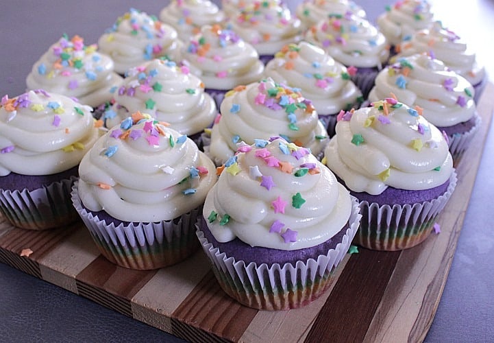 Rainbow Cupcakes with Cream Cheese Icing. Super fun and delicious rainbow cupcakes with a perfect cream cheese icing are great for birthdays and baby showers!