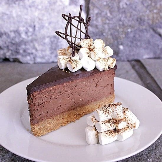 S’mores Cheesecake. Bring in the summer with this s'mores cheesecake! Graham crumb crust, chocolate cheesecake with ganache topping, finished off with toasted marshmallows. 