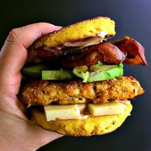 Low Carb Chipotle Chicken Burger. Deliciously breaded chipotle chicken burger loaded with aged cheddar, crisp bacon, thick sliced avocado and sandwiched together by a cheesy 90 second keto bun.