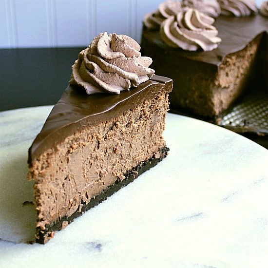 Quadruple Chocolate Cheesecake. Four layers of rich, sensational, chocolate love. Oreo crumb crust. Velvety chocolate cheesecake. Intense chocolate ganache. Fluffy chocolate whipped cream. This cheesecake is not for the faint of heart.
