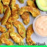 A pile of Keto Avocado Fries next to a halved avocado and a small bowl of chipotle mayo.