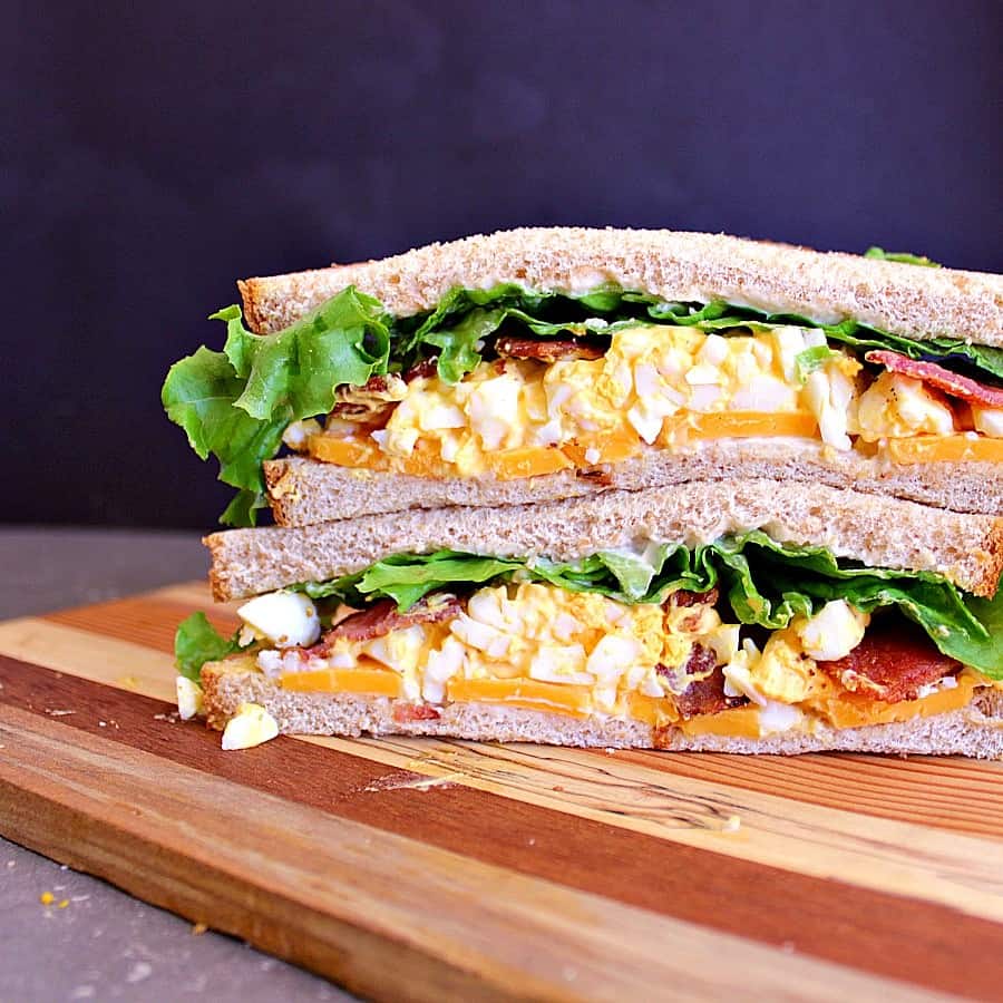 A classic Egg Salad Sandwich loaded with crispy bacon and sharp cheddar cheese. 