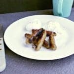 plate with low carb maple breakfast sausages and two poached eggs.