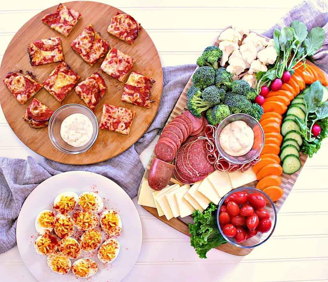 Appetizer night! Veggie board with ranch, cheese and meats. Devilled eggs and a platter of low carb pizza bites.
