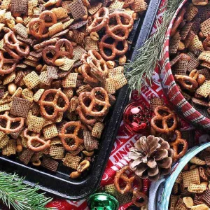 This crunchy, salty, perfectly spiced Addicting Christmas Chex Mix is a great snack for the Christmas season or to make for easy and yummy gifts.