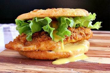 Keto Chicken Burger with keto honey mustard on a low carb onion bun.