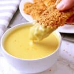 Crunchy Low Carb Baked Chicken Tender dipped in Low Carb Honey Mustard.