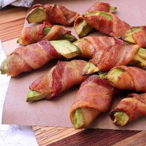 Pile of bacon wrapped avocado fries.