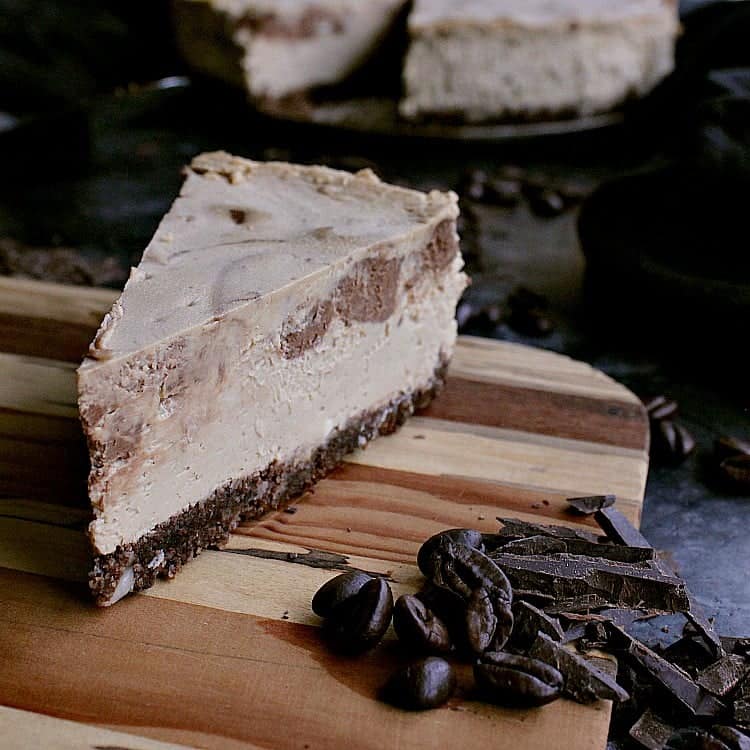 keto mocha cheesecake with one slice removed.
