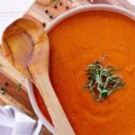 Skillet with keto marinara sauce, garnished with chopped basil.