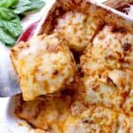 baking dish with cabbage lasagna, one slice removed.