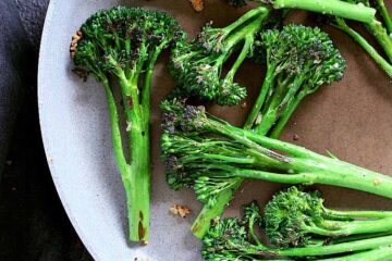 Skillet full of sautéed broccolini.