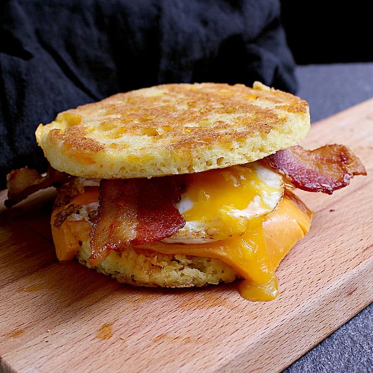 Keto breakfast sandwich on a 90 Second Keto Bread with an egg, cheddar and bacon.