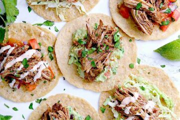 Almond flour tortillas filled with toppings and keto carnitas.