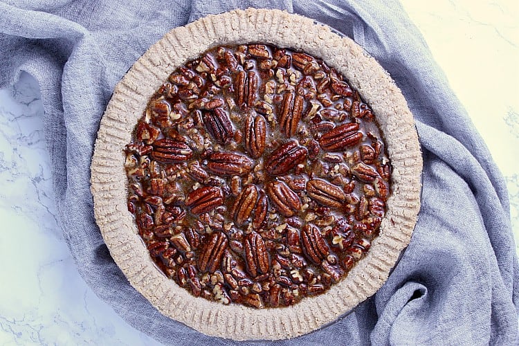 Pie crust filled with pecans and filling.