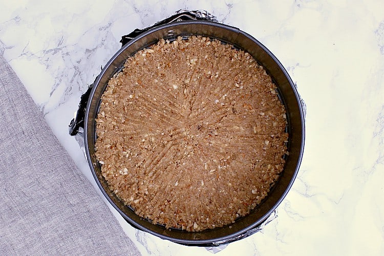 The crust all made and pressed into the bottom of the springform pan.