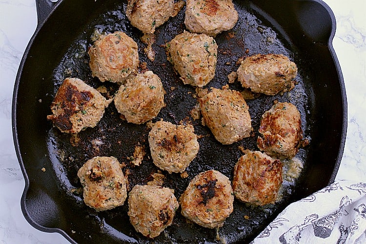 A skillet with the cooked Keto Turkey Meatballs.