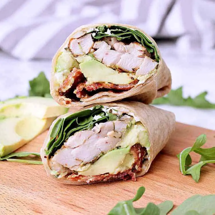 A keto chicken wrap cut in half and stacked on top of itself.