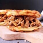 A chaffle loaded with Keto Pulled Chicken.