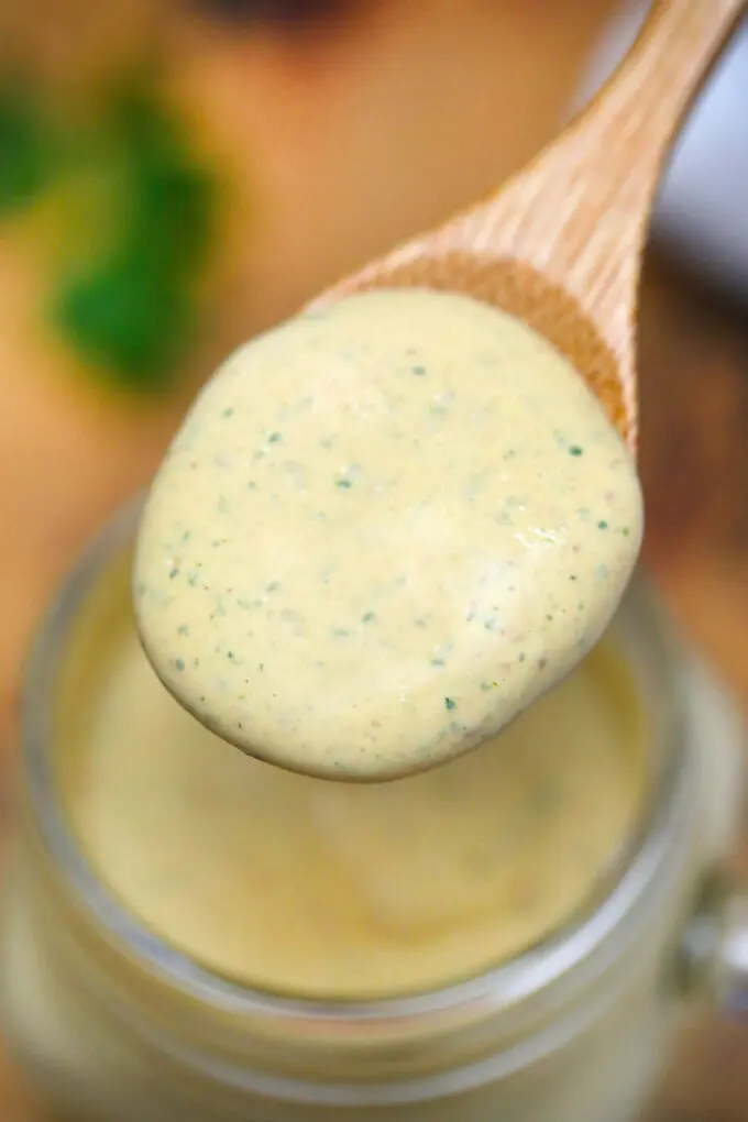 creamy keto sauce on a spoon